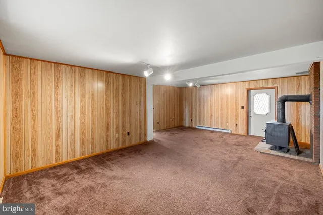 a big room with closet and windows