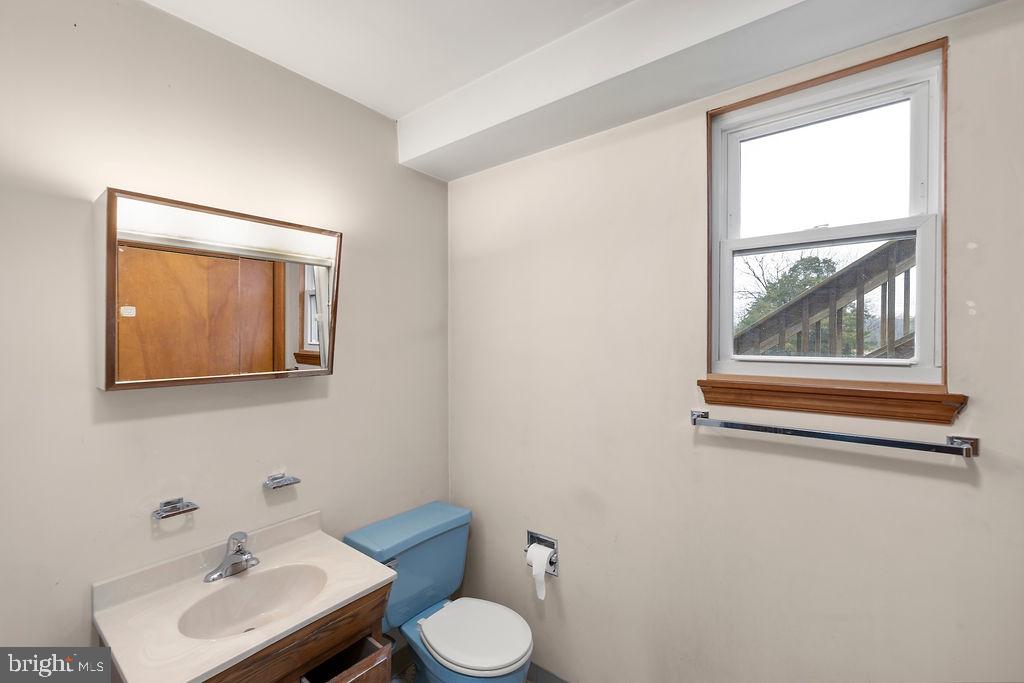 2165 Old Harrisburg Road Gettysburg, PA 17325 - Photo 26 of 44 a bathroom with a toilet a sink and mirror