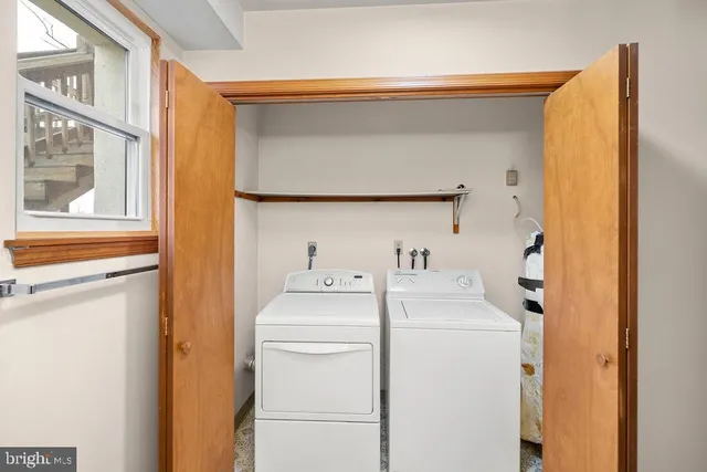 a utility room with dryer and washer