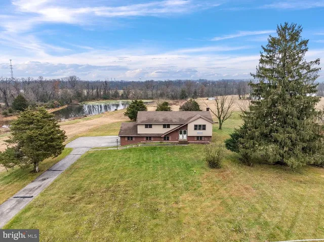 a view of a lake with couches and city view