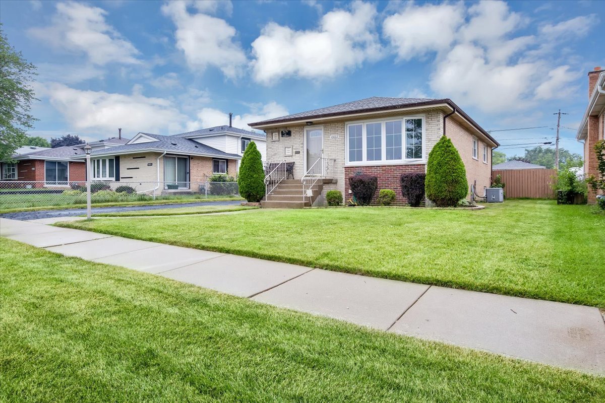 10822 Major Avenue Chicago Ridge, IL 60415 - Photo 1 of 30 a view of a house with a big yard and large trees
