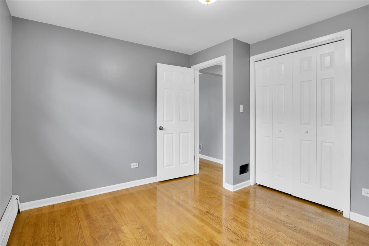 10822 Major Avenue Chicago Ridge, IL 60415 - Photo 11 of 30 a view of an empty room with wooden floor