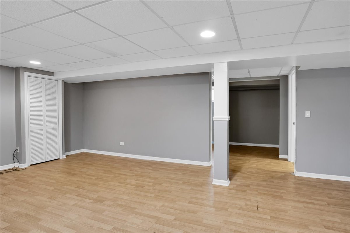 10822 Major Avenue Chicago Ridge, IL 60415 - Photo 23 of 30 an empty room with wooden floor and natural light