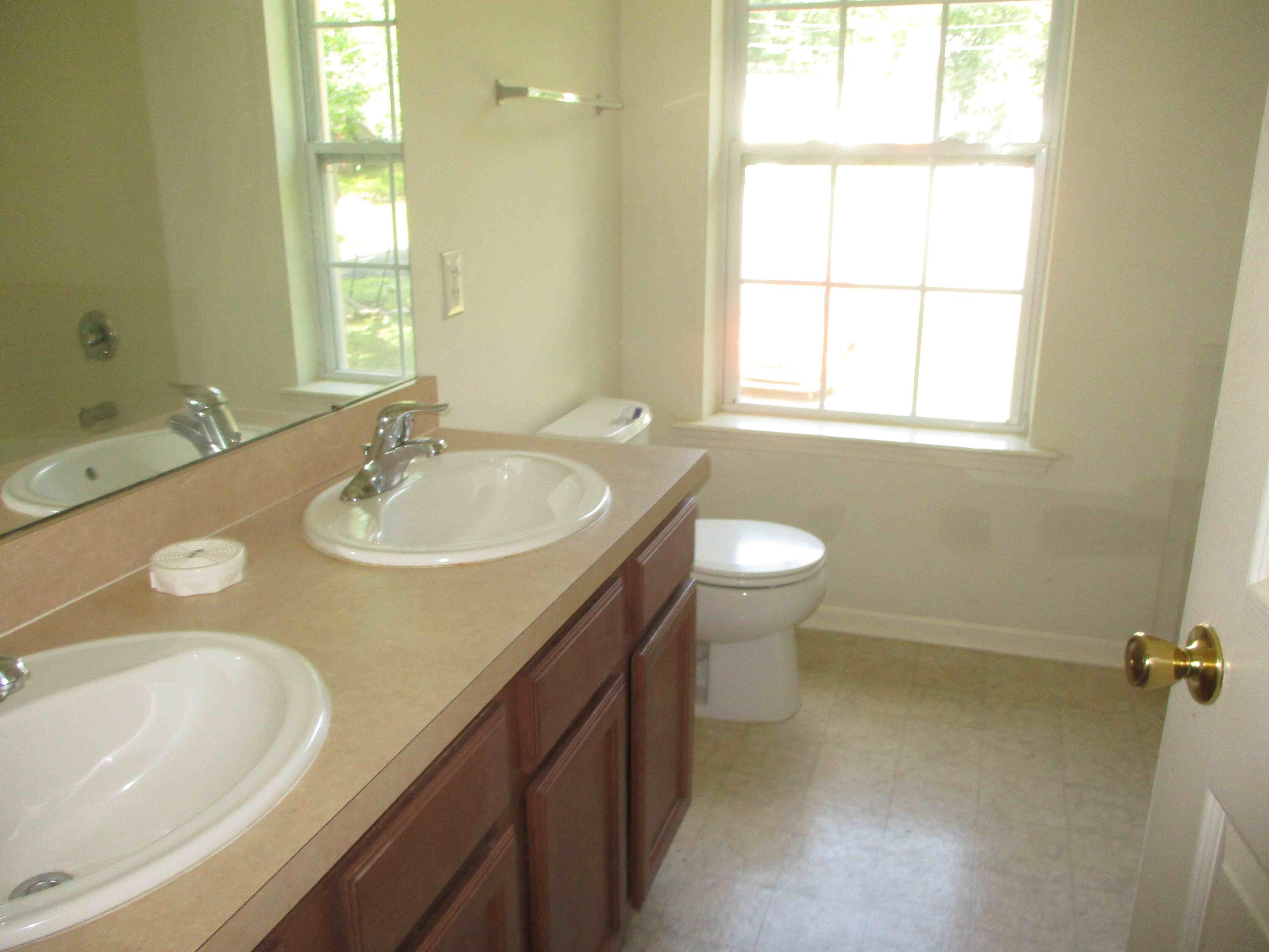 2113 Dorset Court Bushkill, PA 18324 - Photo 7 of 10 a bathroom with a sink and a mirror