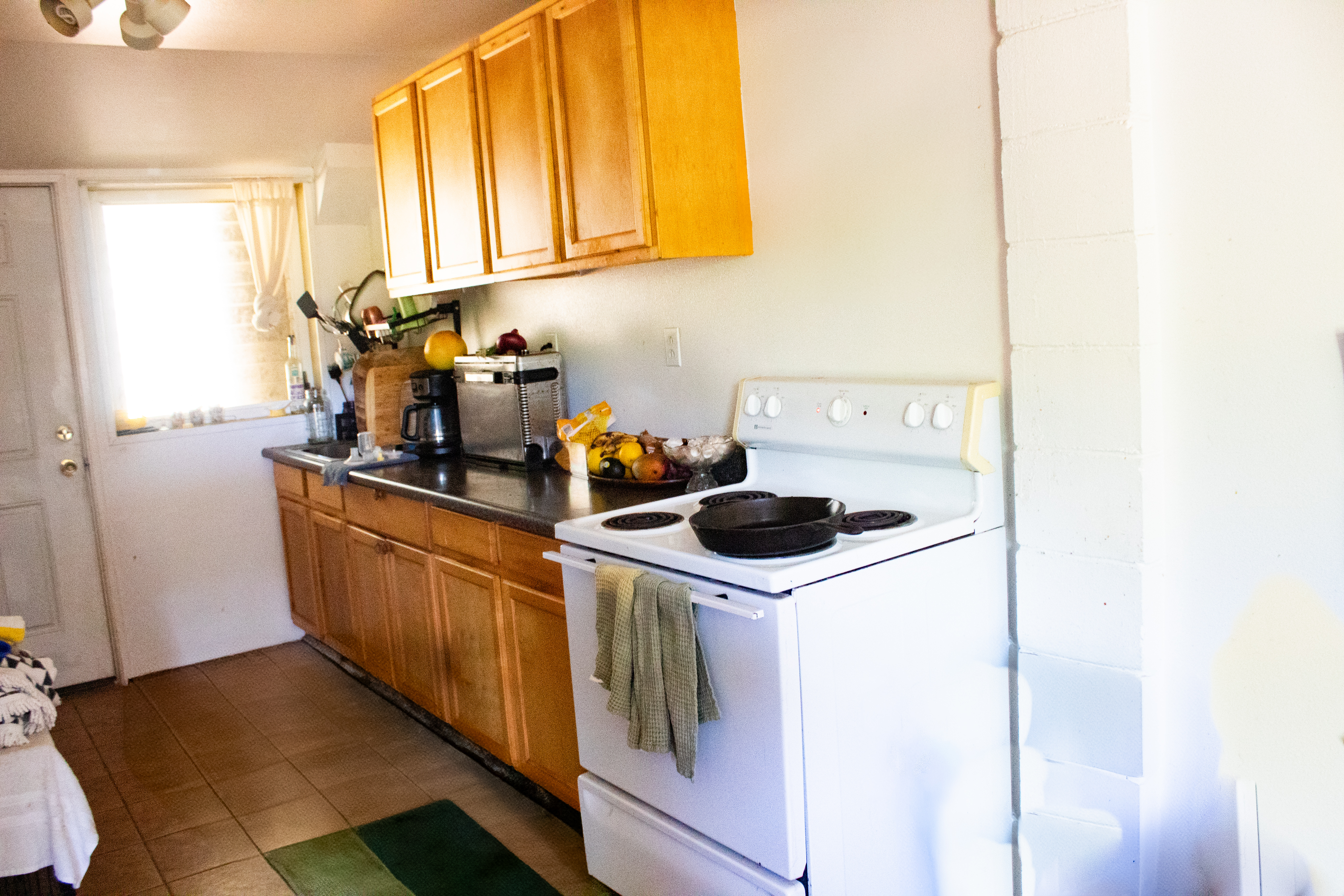 2501 Waipuna Road Lihue, HI 96766 - Photo 21 of 28 a kitchen with a sink and a stove