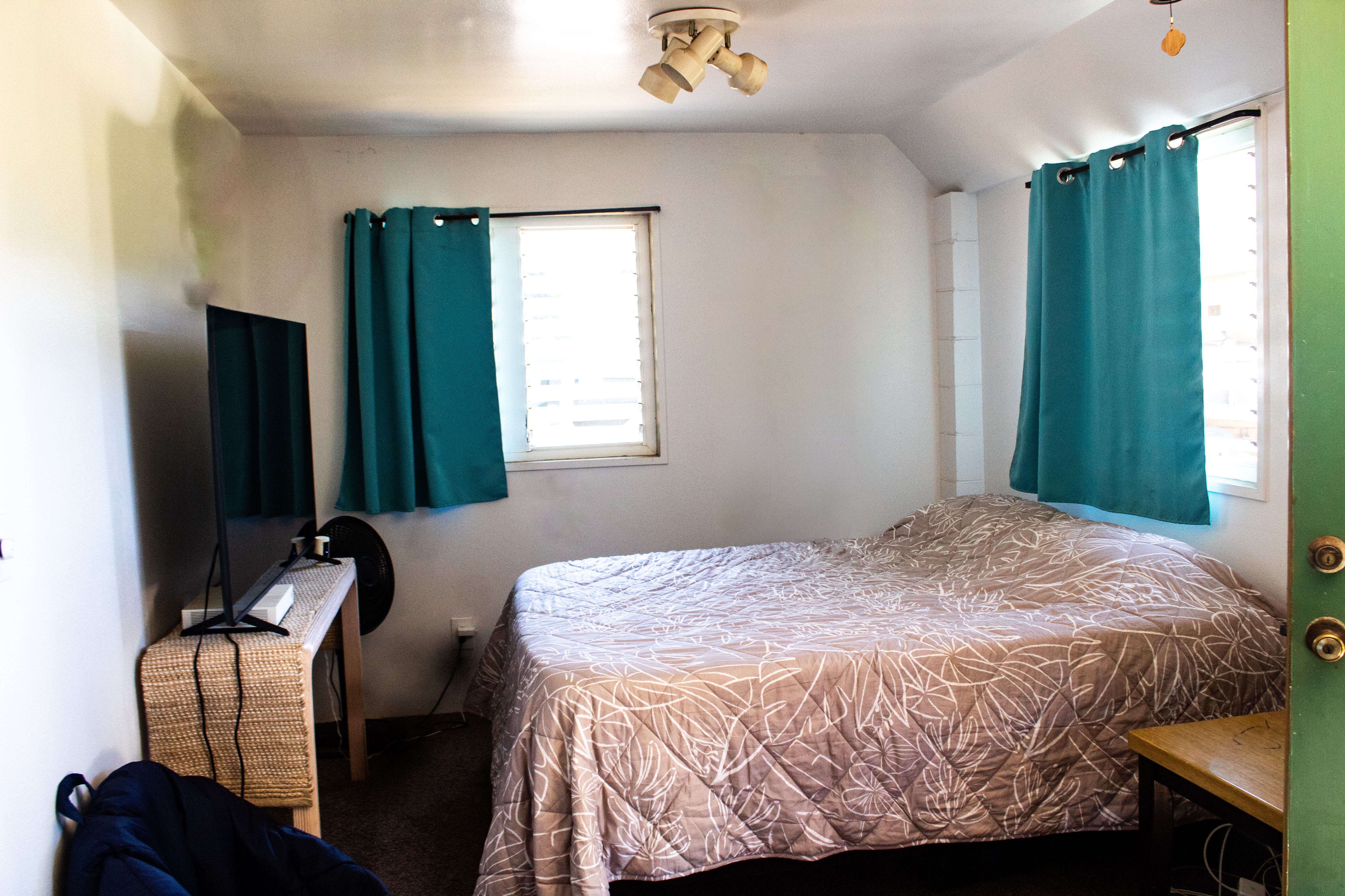 2501 Waipuna Road Lihue, HI 96766 - Photo 23 of 28 a bedroom with a bed and window