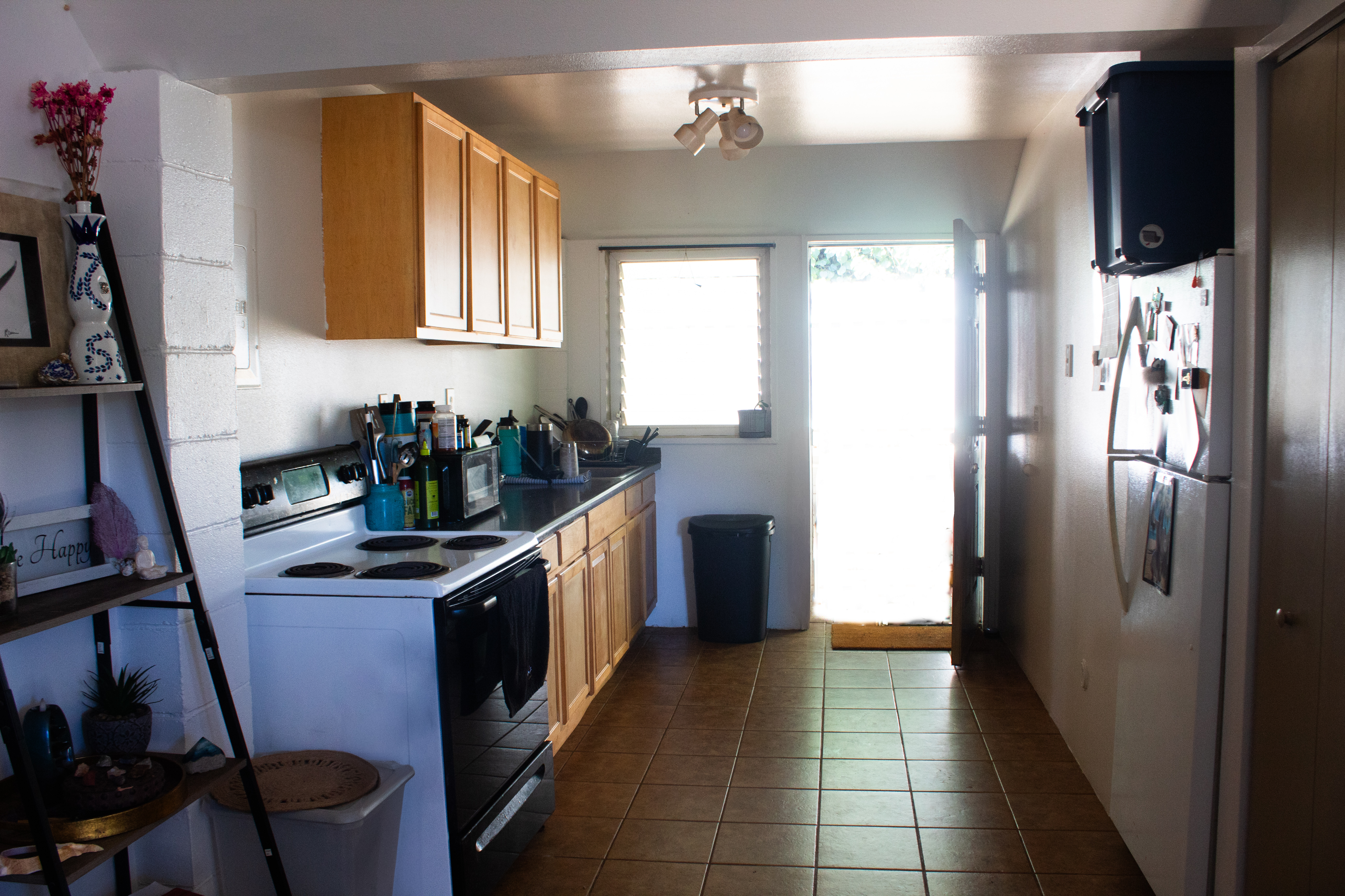 2501 Waipuna Road Lihue, HI 96766 - Photo 25 of 28 a kitchen with stainless steel appliances a sink stove and refrigerator
