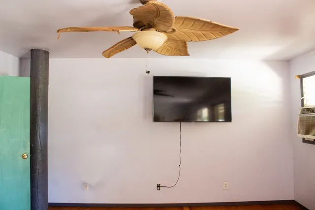 a kitchen with granite countertop white cabinets and sink