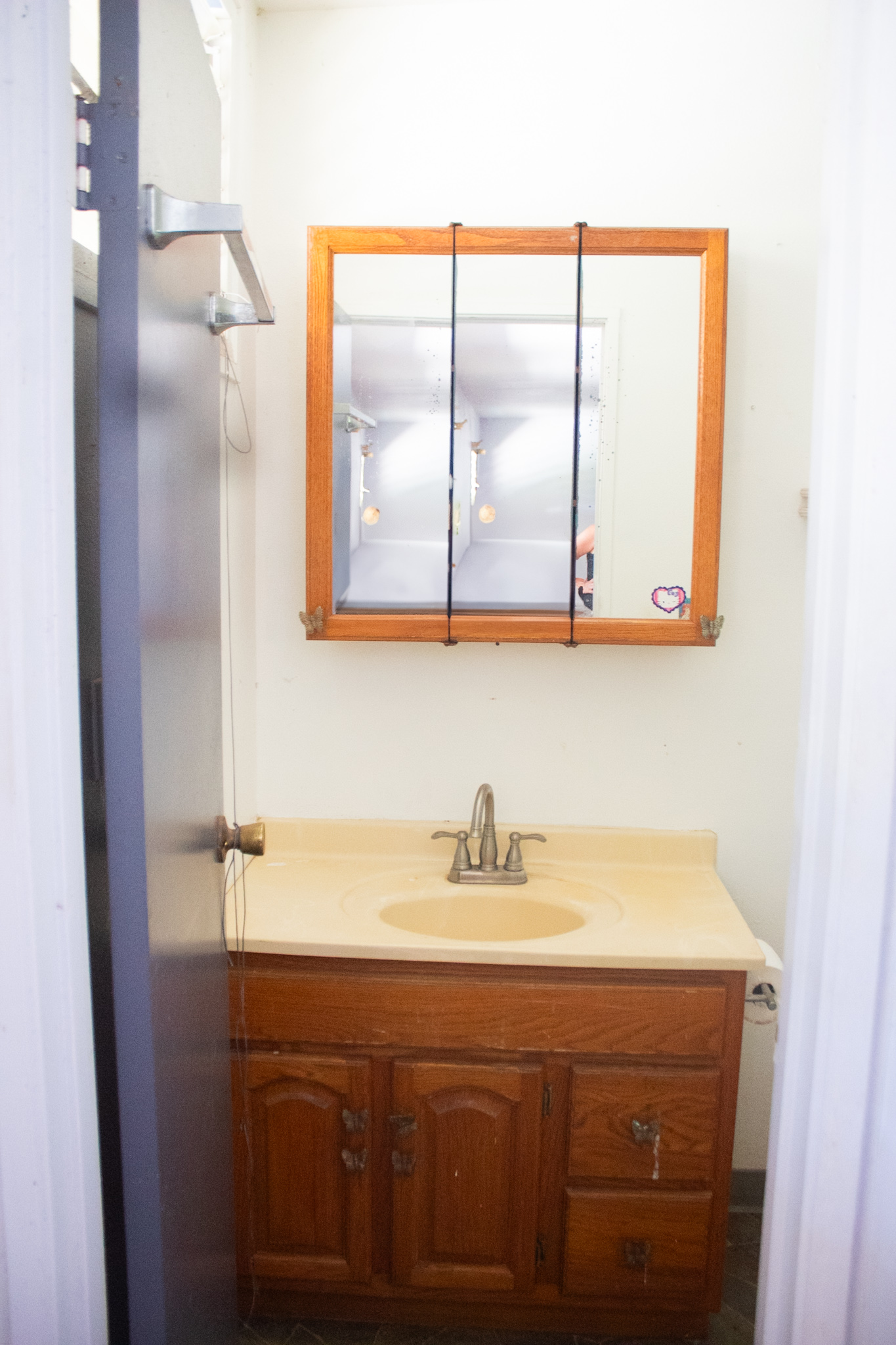 2501 Waipuna Road Lihue, HI 96766 - Photo 27 of 28 a bathroom with a sink and a mirror
