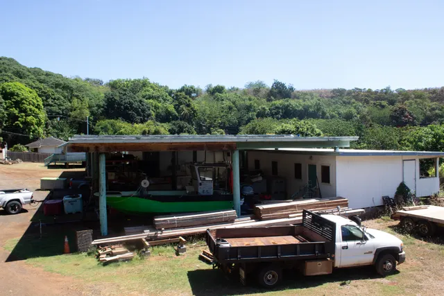 a view of backyard with swimming pool and outdoor seating