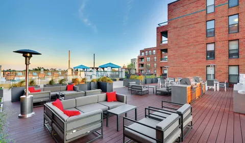 a outdoor space with patio the couches and a dining table with chairs