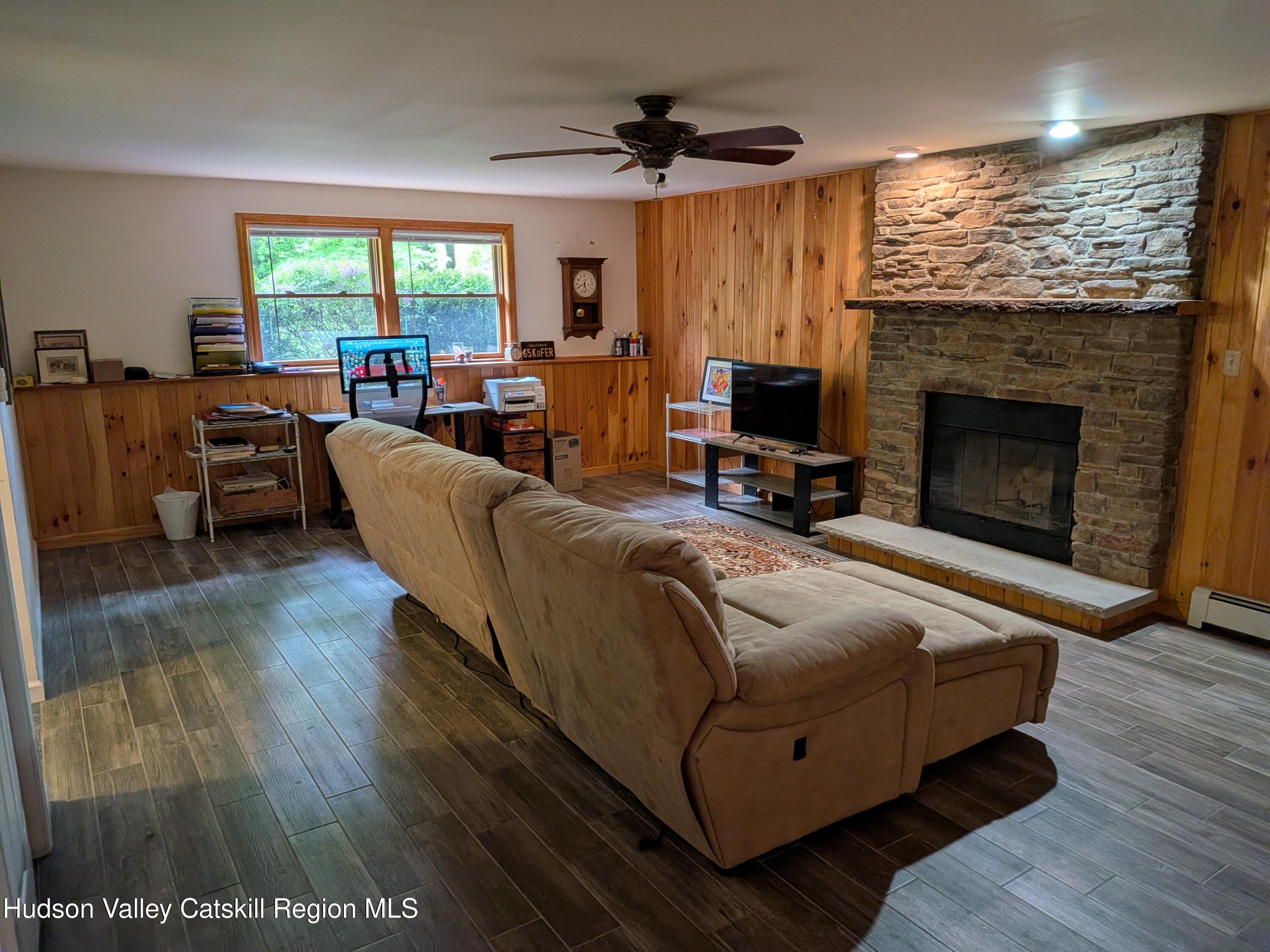 513 South Mountain Road Gardiner, NY 12525 - Photo 31 of 63 a living room with furniture large window and a fireplace
