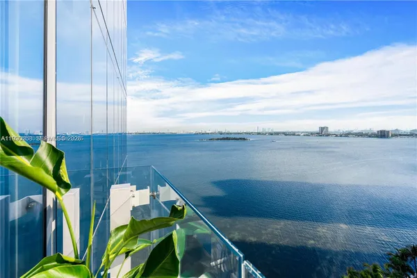 a view of a lake from a balcony