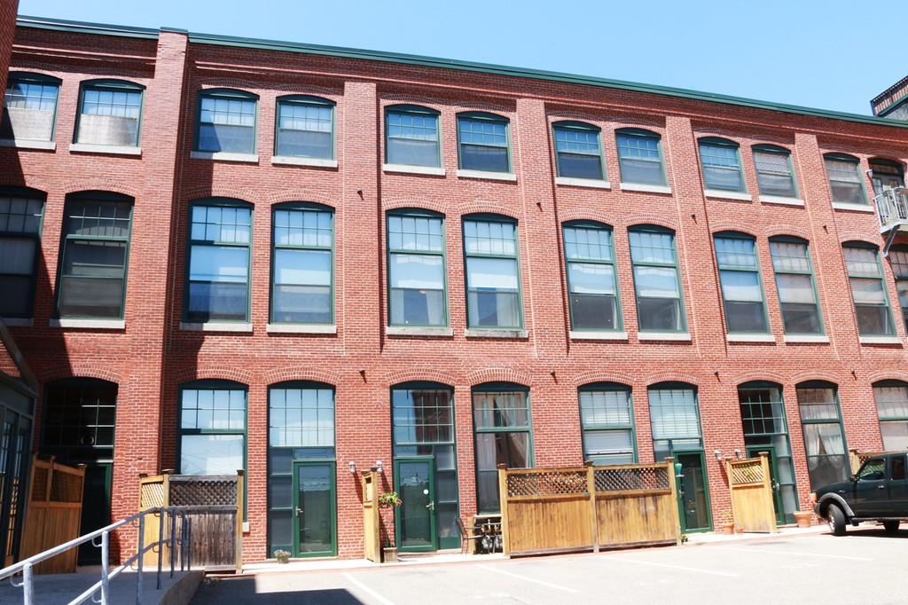 60 Dudley Street, Unit 222 Chelsea, MA 02150 - Photo 18 of 20 a front view of a building with large windows