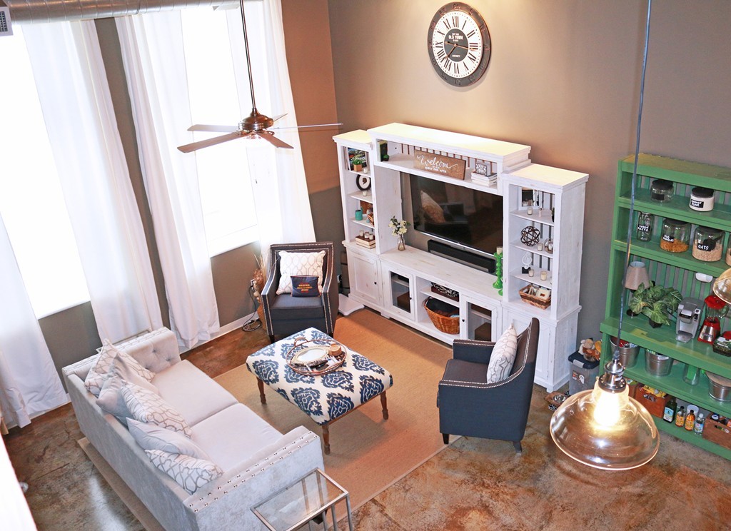 60 Dudley Street, Unit 222 Chelsea, MA 02150 - Photo 2 of 20 a living room with furniture a rug a fireplace and a flat screen tv