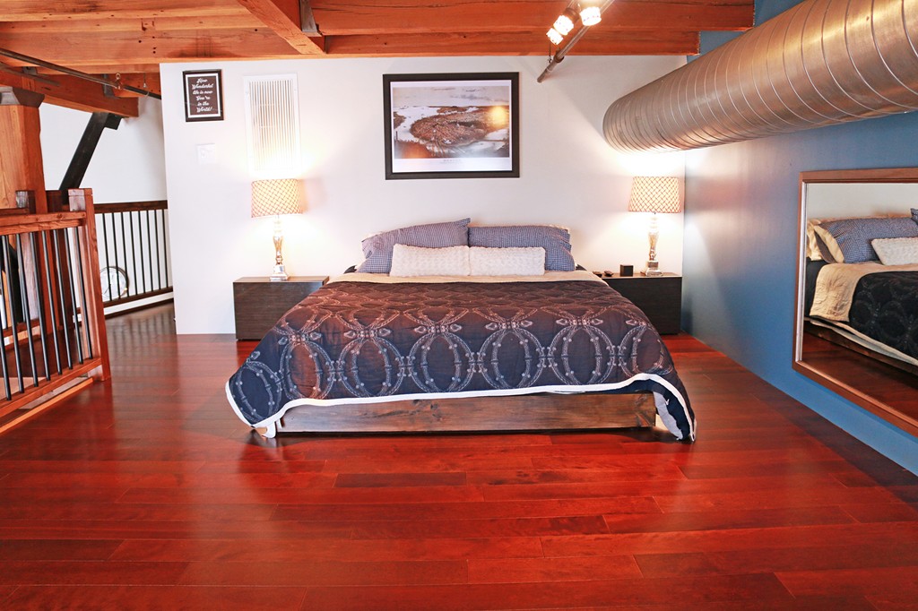 60 Dudley Street, Unit 222 Chelsea, MA 02150 - Photo 5 of 20 a bedroom with a bed and wooden floor