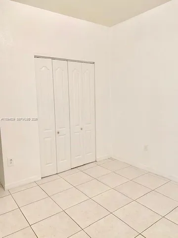 a bathroom with a sink a mirror and a shower