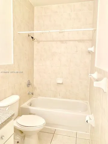 a view of a kitchen with a sink and chandelier