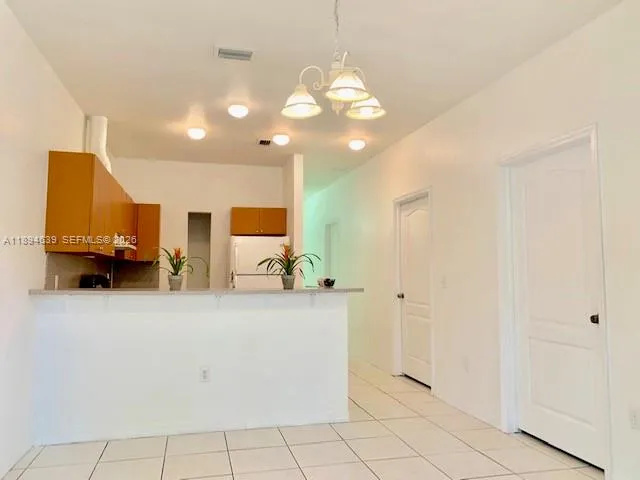 a view of a bench in the backyard of house