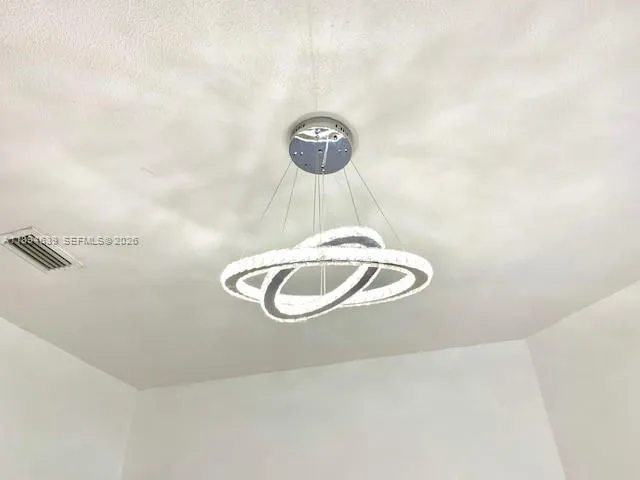 a kitchen with a stove sink and cabinets