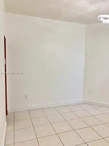 a kitchen that has a sink and a stove in it