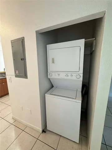 a kitchen with a stove cabinets and a sink