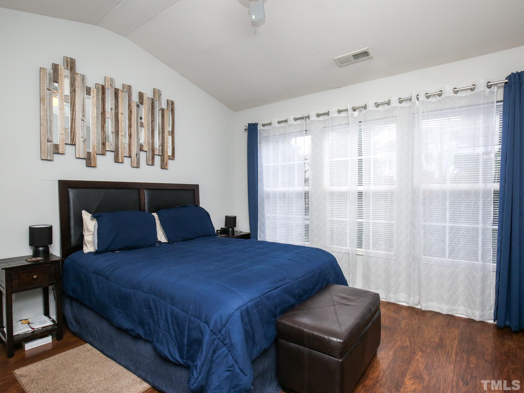 1714 Sorrell Brook Way Raleigh, NC 27609 - Photo 14 of 29 a bedroom with a bed and a window