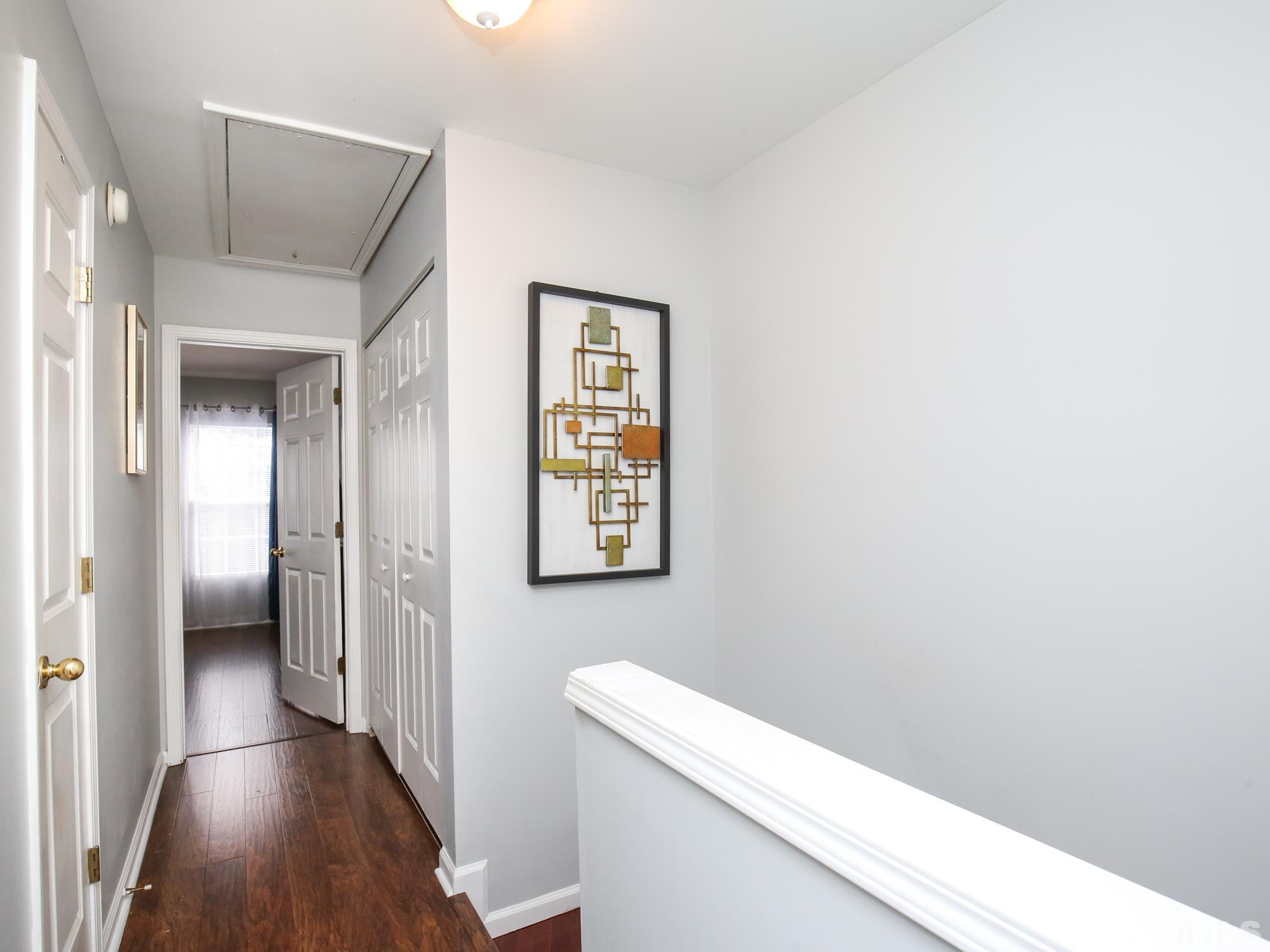 1714 Sorrell Brook Way Raleigh, NC 27609 - Photo 16 of 29 a view of hallway with wooden floor