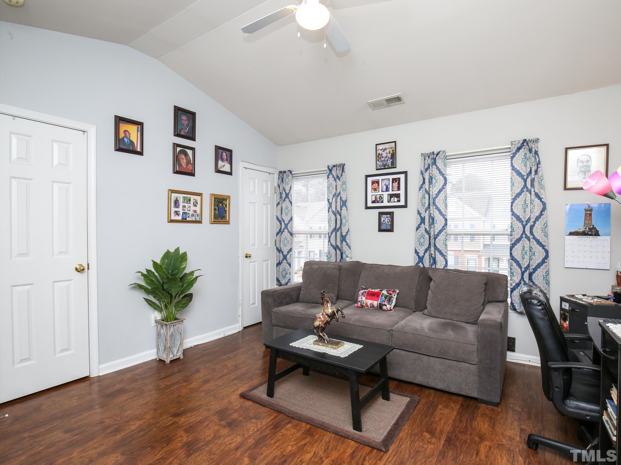 1714 Sorrell Brook Way Raleigh, NC 27609 - Photo 20 of 29 a living room with furniture and wooden floor
