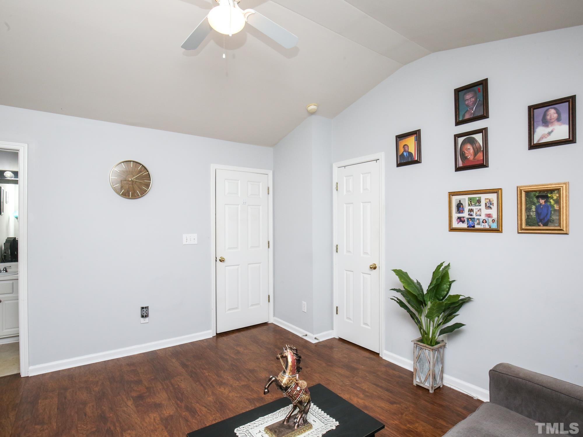 1714 Sorrell Brook Way Raleigh, NC 27609 - Photo 22 of 29 a living room with furniture and a potted plant