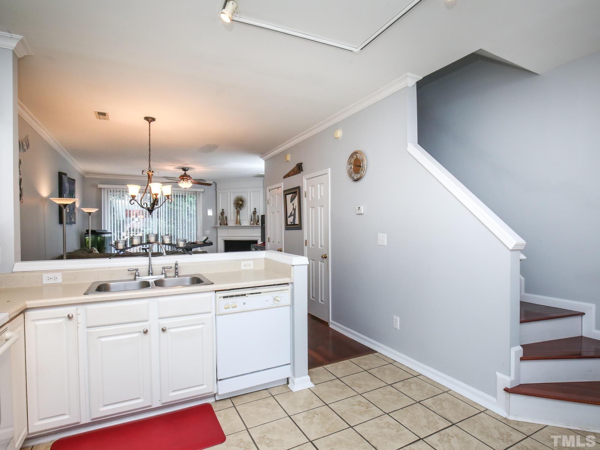 1714 Sorrell Brook Way Raleigh, NC 27609 - Photo 4 of 29 a kitchen with a sink and cabinets