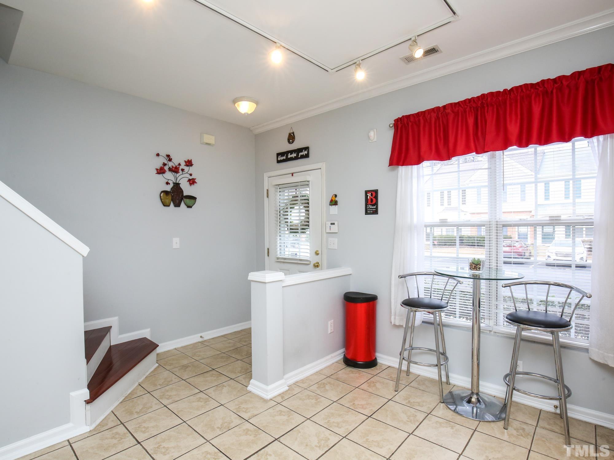 1714 Sorrell Brook Way Raleigh, NC 27609 - Photo 5 of 29 a very nice looking dining room with a large window