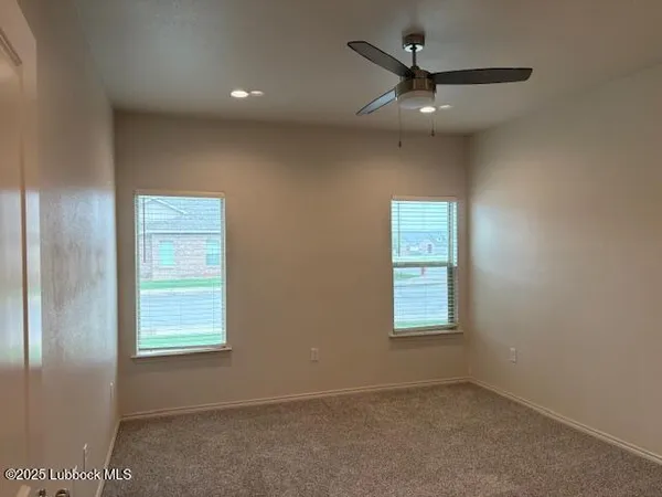 a bathroom with a granite countertop mirror and a sink
