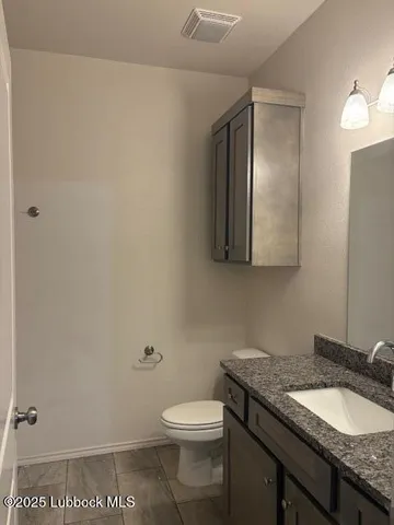 a bathroom with a sink a vanity and a mirror