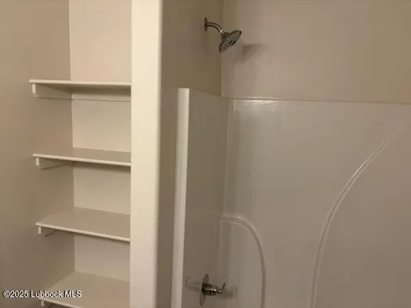 a view of roof deck with table and chairs potted plants with wooden floor