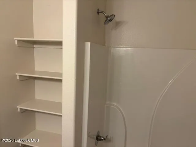 a view of roof deck with table and chairs potted plants with wooden floor