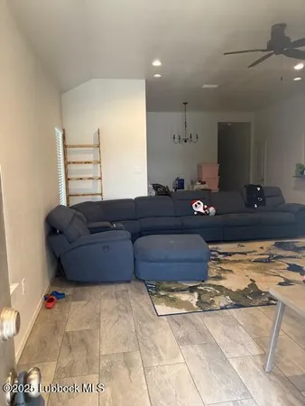 a bedroom with a bed and a television