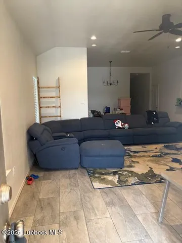 a bedroom with a bed and a television