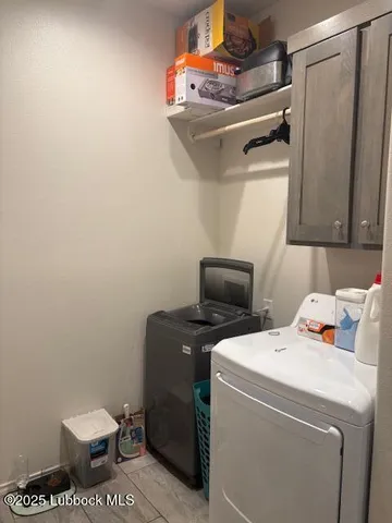 a kitchen with stainless steel appliances granite countertop a sink a stove and a wooden floor