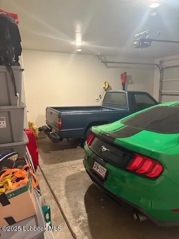 a living room with furniture a chandelier and a flat screen tv
