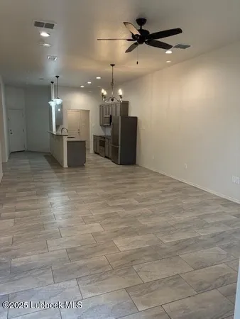 a kitchen with kitchen island a counter space a sink and appliances