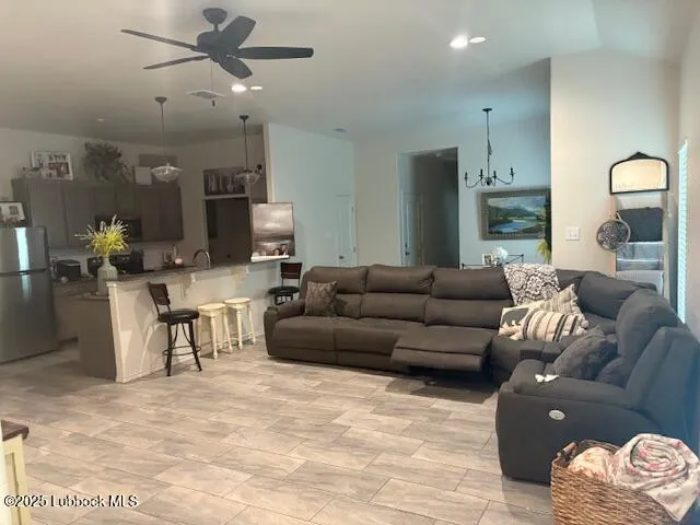 a spacious bedroom with a bed and a couch