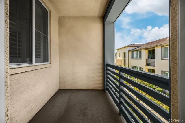a view of a balcony with wooden floor