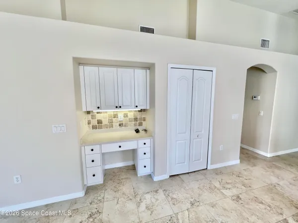 a view of walk in closet with cabinet