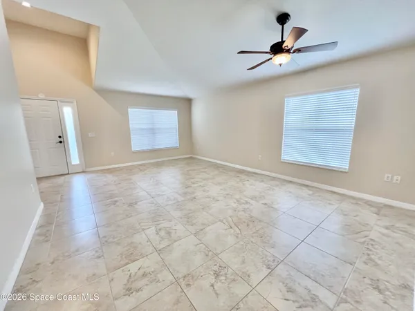 a view of livingroom with hardwood floor and a ceiling fan