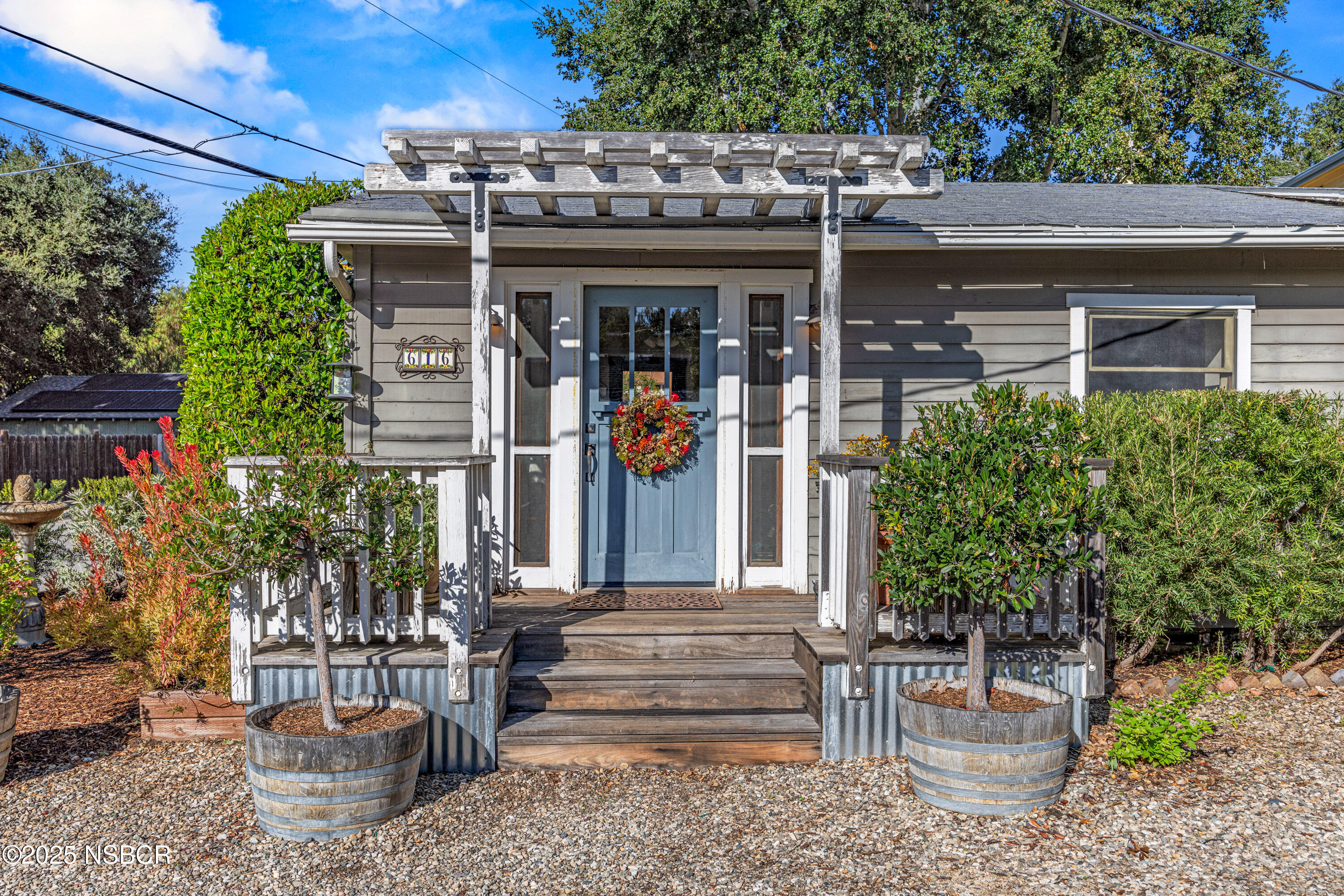 a view of a house with outdoor seating