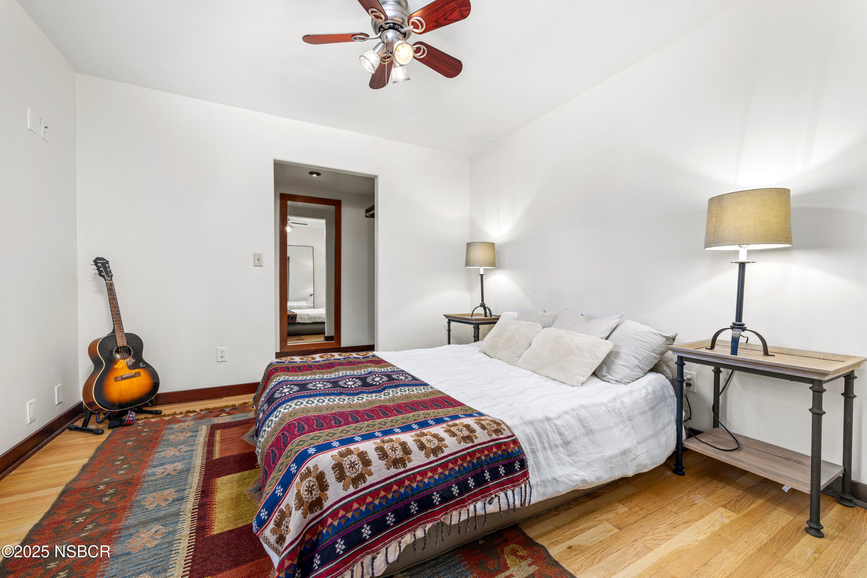 616 Alisal Road Solvang, CA 93463 - Photo 16 of 35 a bedroom with a bed and a lamp