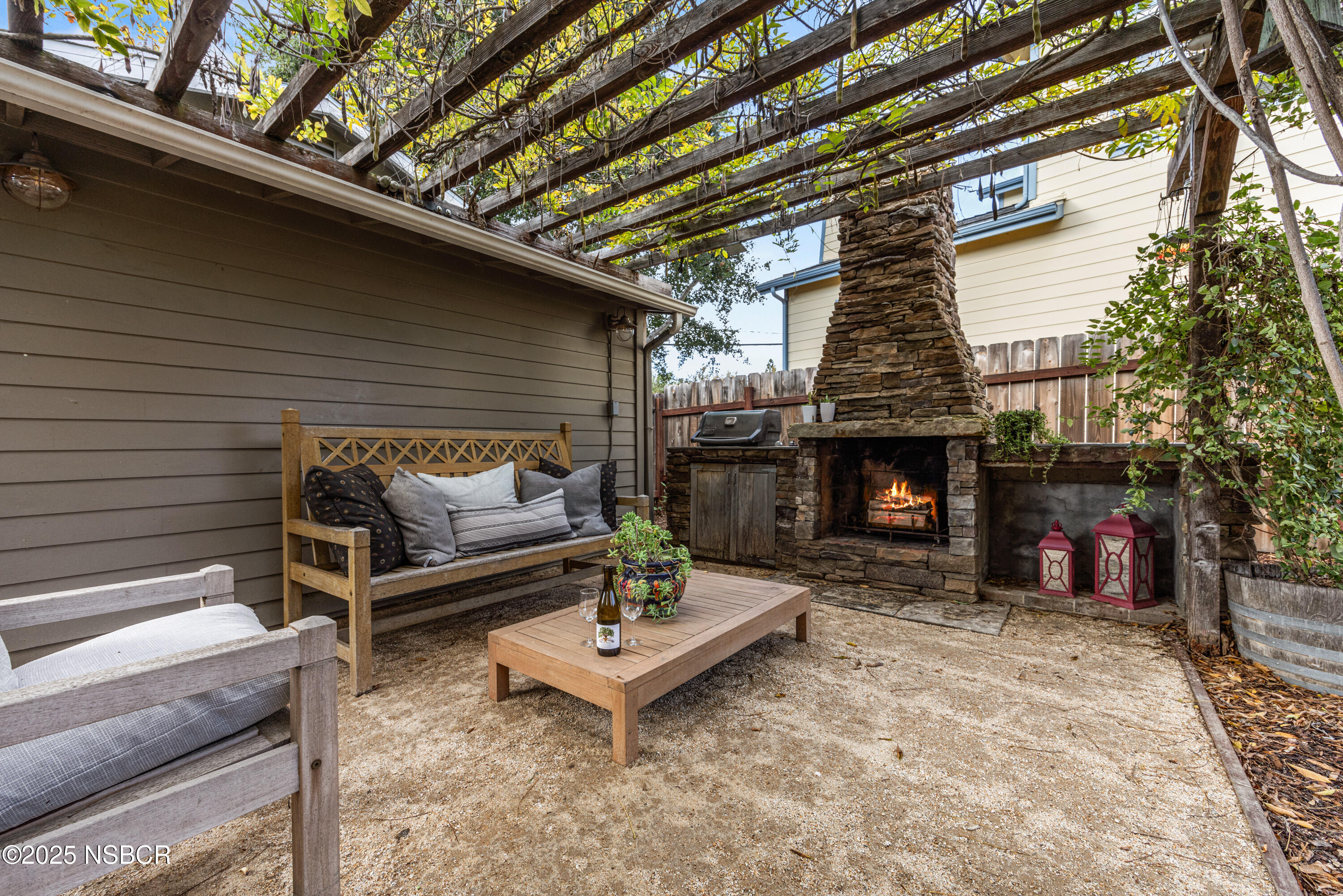 616 Alisal Road Solvang, CA 93463 - Photo 22 of 35 a outdoor space with a couch and a fireplace
