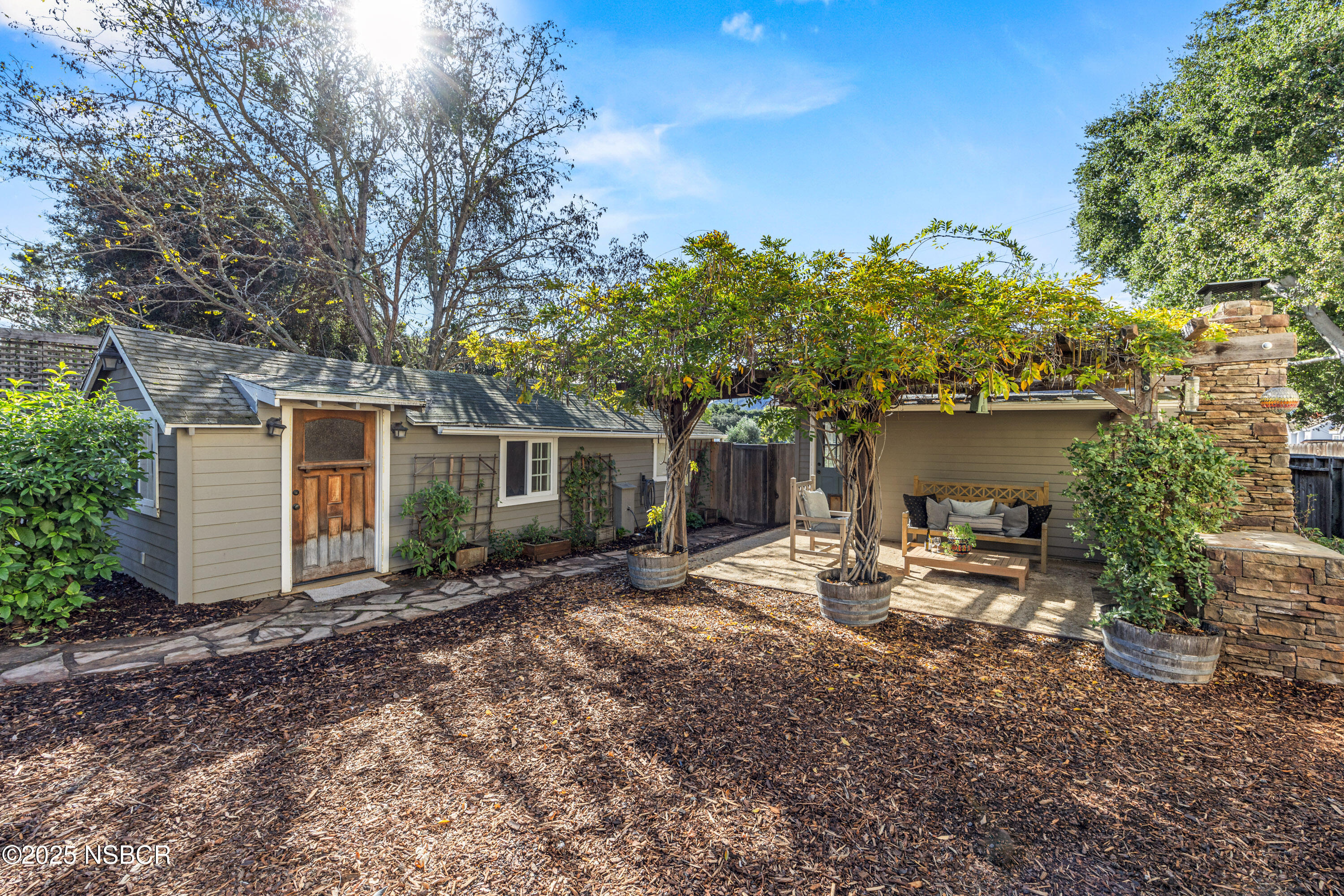 616 Alisal Road Solvang, CA 93463 - Photo 23 of 35 a backyard of a house with seating space