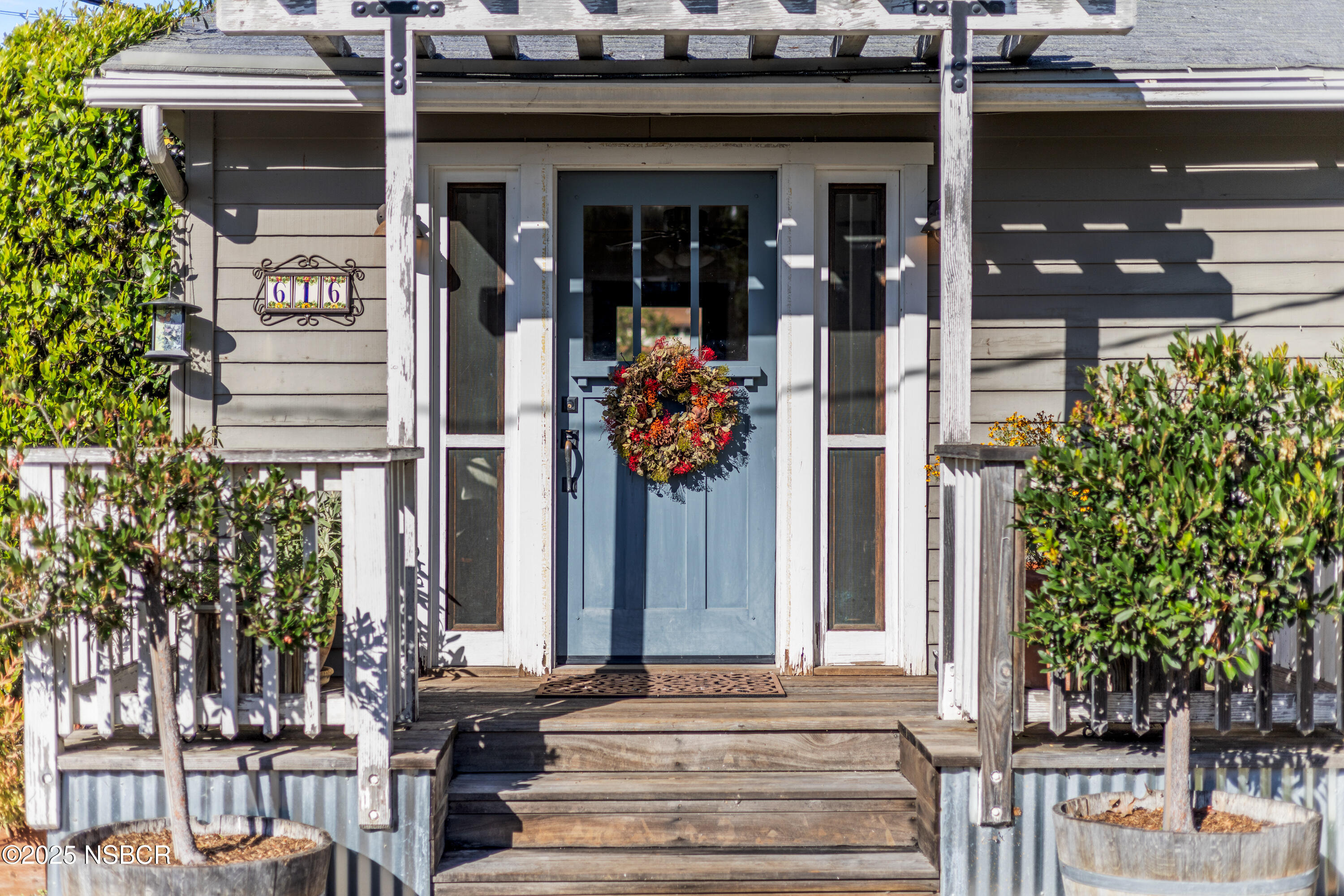 616 Alisal Road Solvang, CA 93463 - Photo 27 of 35 front view of a building with a garden